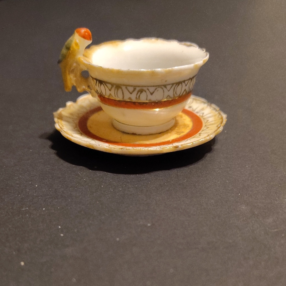 Elegant Orange and Cream Teacup with Saucer